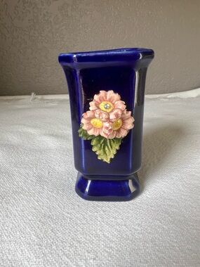 vintage blue glazed ceramic art pottery vase featuring a pink floral applique